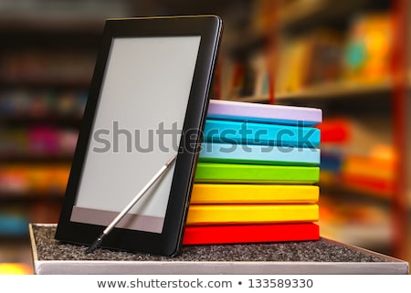 Stock fotó: Stack Of Books With Electronic Book Reader