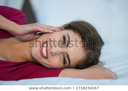 Stock fotó: Closeup Portrait Of Young Pretty Girl Laying On Her Bed