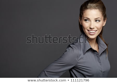 Stockfoto: Pretty Young Brunette Woman Smiling Against Gray Background With