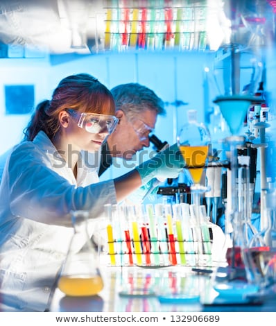 Foto stock: Attractive Young Scientist Pipetting