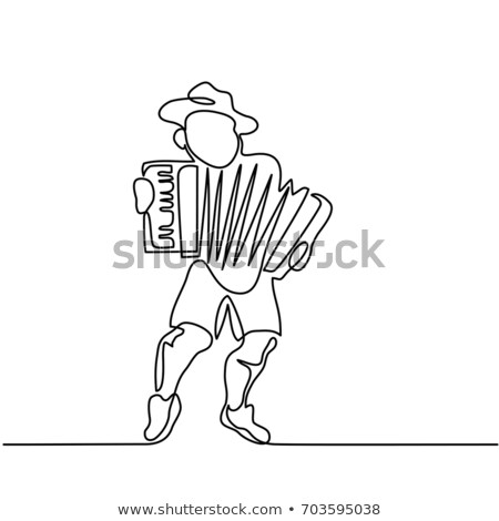 Stockfoto: Enthusiastic Man With Traditional German Costume Celebrating And Kicking A Soccer Ball