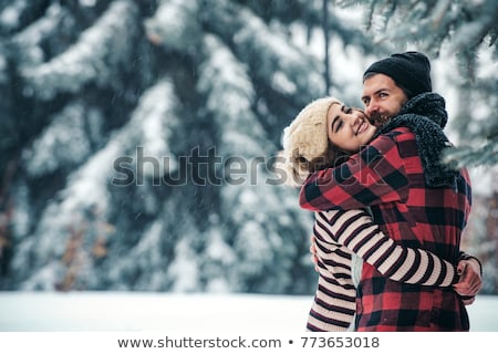 Foto d'archivio: Happy Couple Celebrating Christmas In Forest