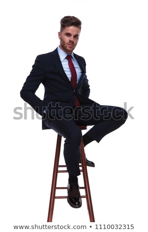 Foto stock: Seductive Businessman Relaxing On Wooden Chair With Hands In Poc