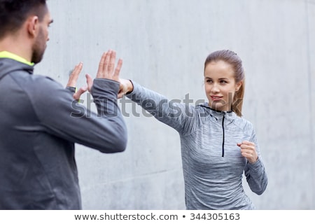 Stock fotó: Happy Woman With Coach Working On Strike Outdoors