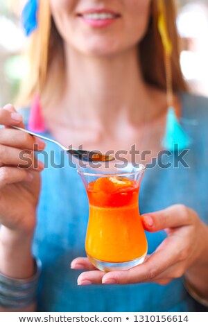 Stock fotó: Woman Eating Citrus Cumquat Jelly Dessert