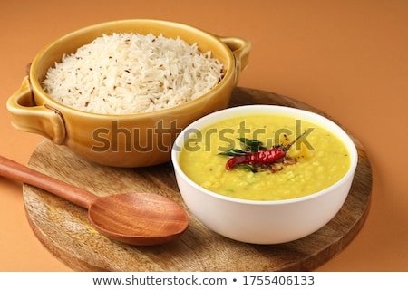 Foto stock: Indian Traditional Food Mung Dal Tadka Curry With Jeera Rice Served In Ceramic Bowls