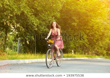 Stock fotó: Young Woman With Bicycle In Forest