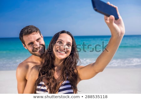 Stockfoto: Woman In Swimsuit Taking Selfie With Smatphone