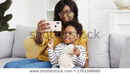 Zdjęcia stock: Father With Baby Daughter Taking Selfie At Home