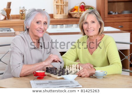 Zdjęcia stock: Two Old Women Playing Chess In Kitchen