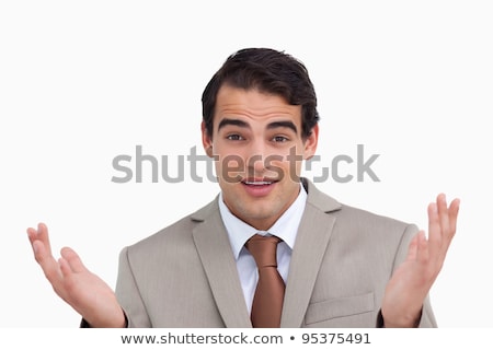 Foto stock: Close Up Of Clueless Salesman Against A White Background