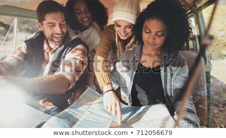 Foto stock: Traveler With Map In Minivan