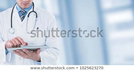 Stockfoto: Male Doctor Using An Futuristic Digital Tablet