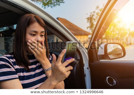 Stok fotoğraf: Woman Driving A Car - Female Driver At A Wheel Of A Modern Car