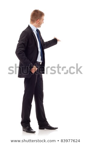 Stok fotoğraf: Smiling Young Businessman Presenting Something To His Back