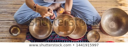 Foto stock: Nepal Buddha Copper Singing Bowl At Spa Salon Young Beautiful Woman Doing Massage Therapy Singing B