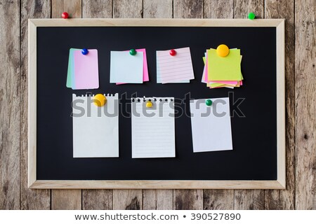 Foto d'archivio: Blackboard With Stickers And Memo Notes On Magnets