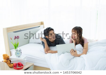 Zdjęcia stock: Couple Happily Laying In Bed Together