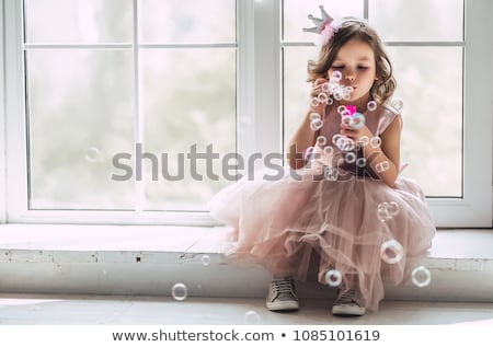 Stok fotoğraf: Little Girl Playing With Bubbles
