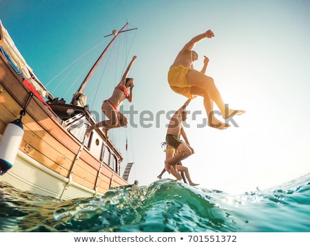 Das Mädchen springt aus dem Meer Stock foto © DisobeyArt