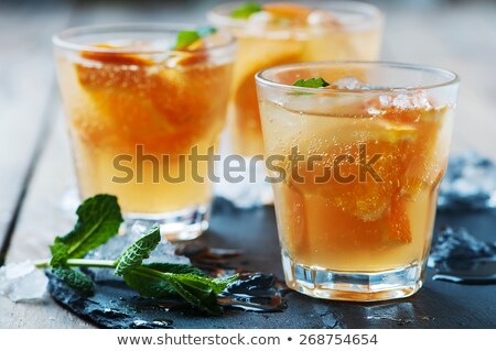 Foto stock: Fresh Cocktail With Orange Mint And Ice Selective Focus