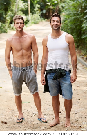 Stock photo: Two Men Standing Outdoors Bonding And Smiling