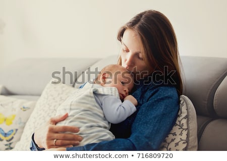 Stockfoto: Mother Kissing Baby