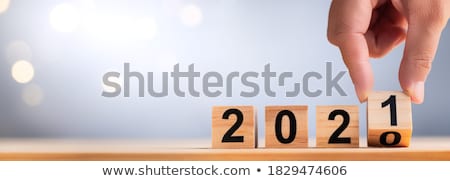 Stock foto: Hand Holding Wooden Block From Word Trend