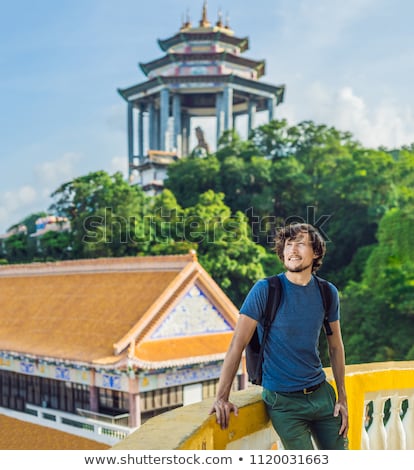 Stok fotoğraf: Young Man Tourist In Buddhist Temple Kek Lok Si In Penang Malaysia Georgetown