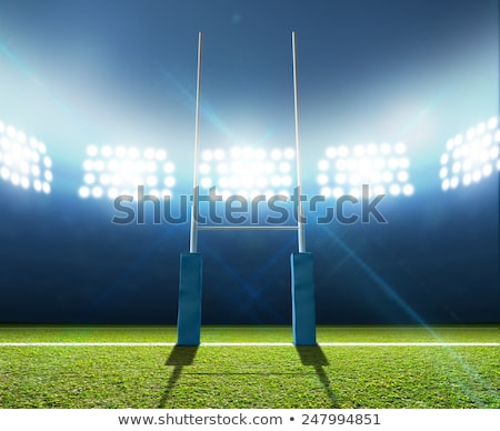 Stock photo: Floodlit Stadium And Rugby Ball