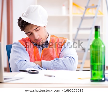 Сток-фото: Drunk Engineer Working In The Workshop