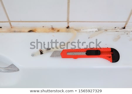 [[stock_photo]]: Bathroom Renovation Old Silicone Removal