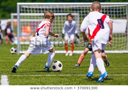 Foto stock: Junior Soccer Match Duel Football Game For Youth Players Boys Playing Soccer Match On Football Pit