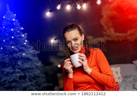 Zdjęcia stock: Girl In Winter New Years Evening On The Background Of A Festive Carousel