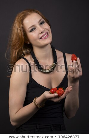 Foto stock: Gorgeous Woman Wearing Strawberries In Her Hair