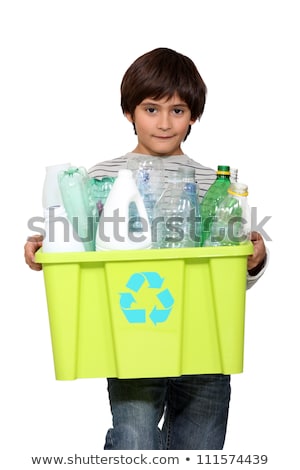 Foto d'archivio: Kid Holding Recycling Tub Full Of Empty Plastic Bottles