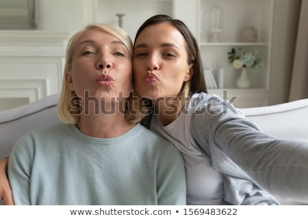 Stok fotoğraf: Blond Woman Blowing Kiss At Camera