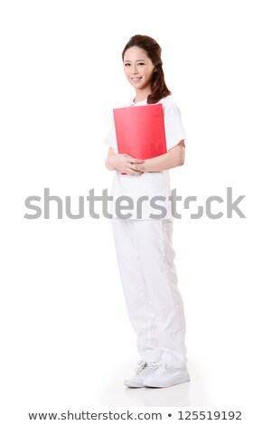 Portrait Of A Smiling Nurse Against A White Background Foto d'archivio © elwynn