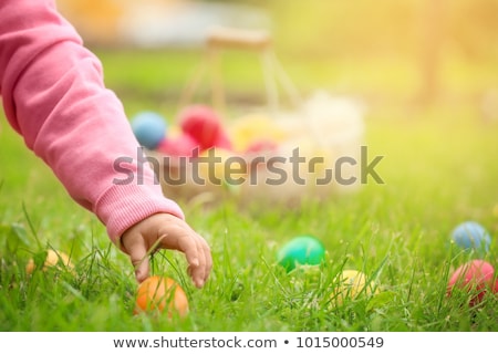 ストックフォト: Girl On Easter Egg Hunt With Eggs