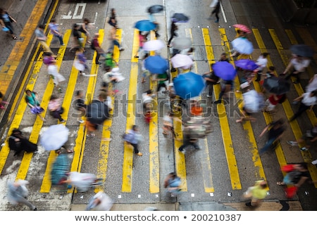 Foto stock: People Moving At Zebra Crosswalk Hong Kong