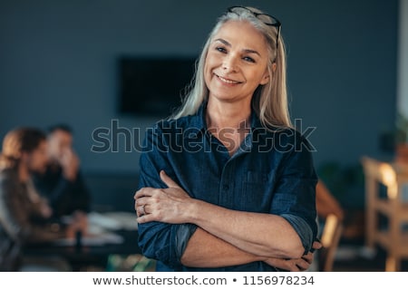 [[stock_photo]]: Portrait Of A Businesswoman Smiling With Her Arms Crossed