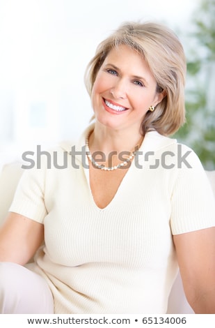 微笑的中年婦女 商業照片 © kurhan