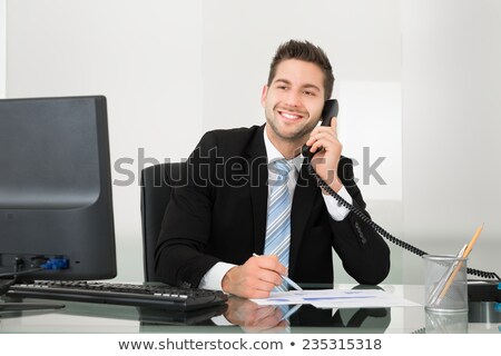 Zdjęcia stock: Young Man Holds The Cord Of A Telephone