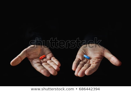 Foto stock: Finger Holds Blue Pill