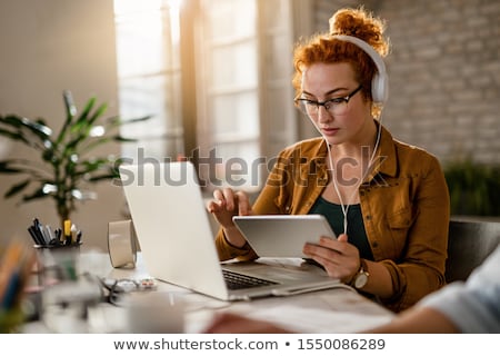 Foto stock: Designer Using Graphic Tablet While Working On Computer