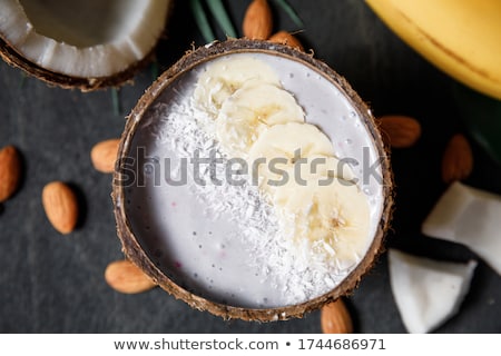 Stock photo: Chia Seed Pudding With Almond Milk And Fresh Mango Topping In Hand