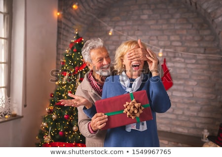 ストックフォト: Happy Smiling Senior Couple With Christmas Gift