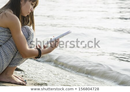 [[stock_photo]]: Girl And A Message In A Bottle