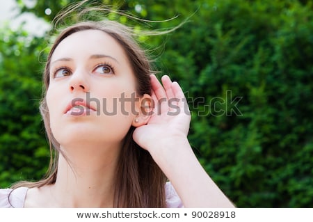 Relying On Hand Ear Listening Young Woman [[stock_photo]] © ilolab