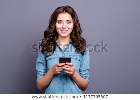 Foto stock: Cute Brunette Happy To Receive Sms